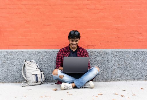 Student working on computer with access to eduroam mobile roaming services