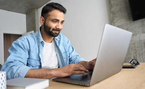 Indian man studying online